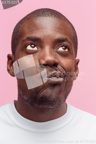 Image of Positive thinking African-American man on pink background