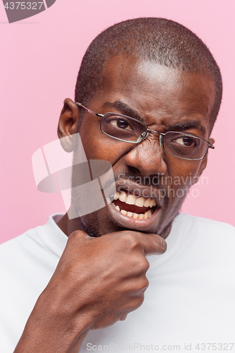 Image of Positive thinking African-American man on pink background