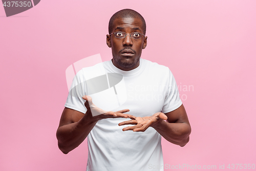 Image of The portrait of handsome young surprised black african man