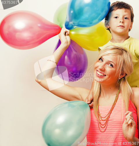 Image of pretty real family with color balloons on white background, blon