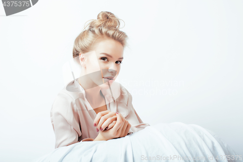 Image of young pretty woman happy smiling, laying in bed, lifestyle people concept