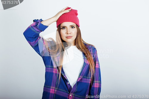 Image of young pretty teenage hipster girl posing emotional happy smiling on white background, lifestyle people concept 