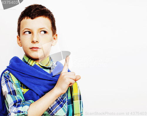 Image of young pretty little cute boy kid wondering, posing emotional face isolated on white background, gesture happy smiling close up, lifestyle real people concept