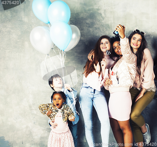 Image of Lifestyle and people concept: young pretty diversity nations woman with different age children celebrating on birth day party together happy smiling, making selfie. African-american, asian and caucasi