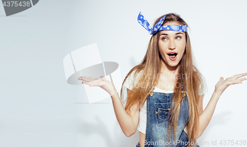 Image of young pretty teenage hipster girl posing emotional happy smiling on white background, lifestyle people concept