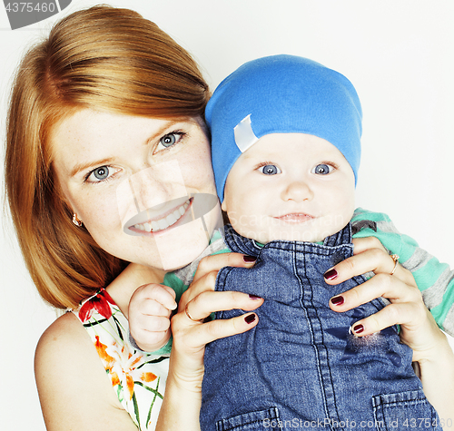 Image of young beauty mother with cute baby, red head happy modern family smiling isolated on white background close up, lifestyle people concept