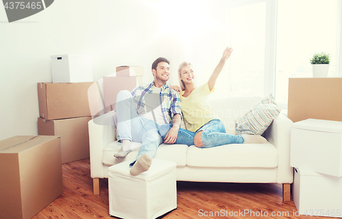 Image of couple with boxes moving to new home and dreaming