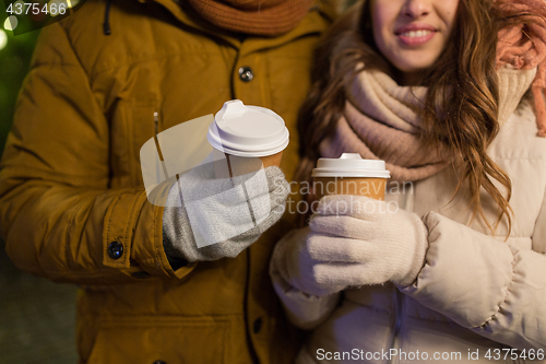 Image of close up of happy couple with coffee at christmas