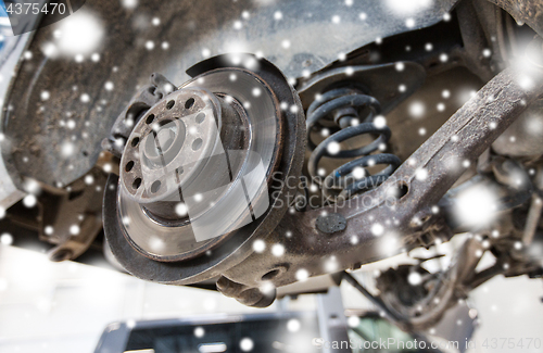 Image of car brake disc at repair station