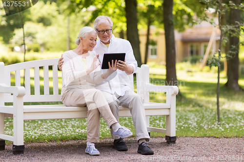 Image of senior couple with video chat on tablet pc at park