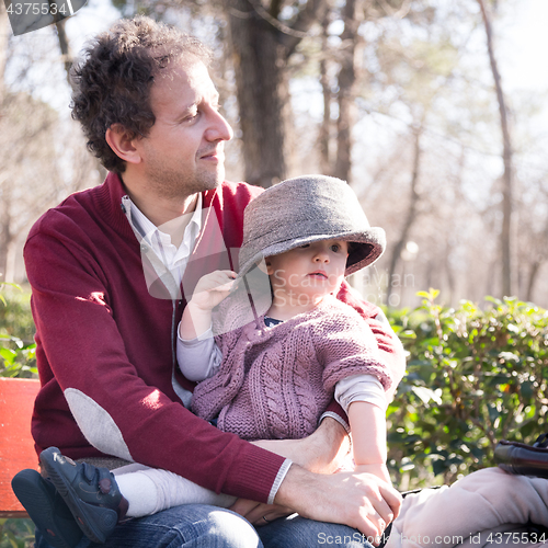 Image of Father with cheerful child in the park.