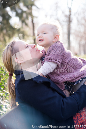 Image of Father with cheerful child in the park.