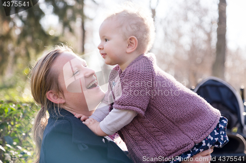 Image of Father with cheerful child in the park.