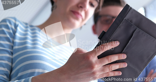 Image of low angle shot of business people using technology