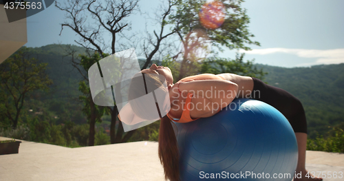 Image of Woman Doing Yoga at villa\'s terase