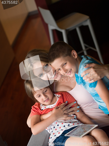 Image of Young Family Using A Tablet To Make Future Plans