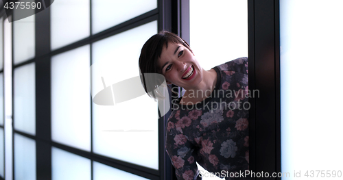 Image of Business woman having fun in office building
