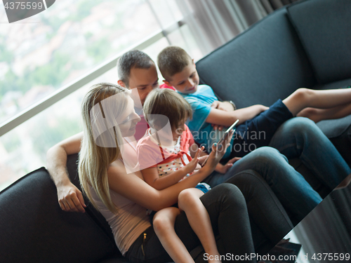 Image of young cuple spending time with kids