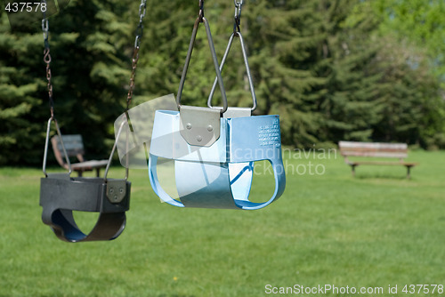 Image of Two Empty Baby Swings