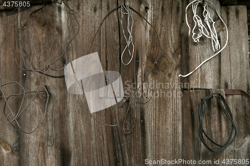 Image of Old wooden wall with rusty objects