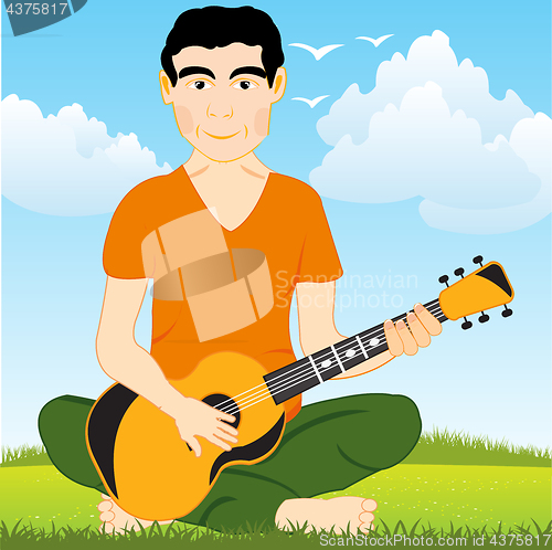 Image of Man on glade plays on guitar