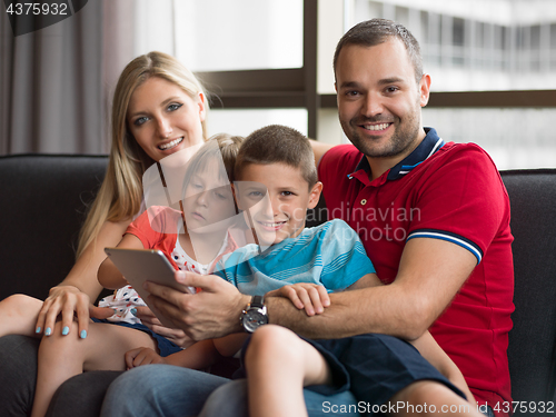 Image of young cuple spending time with kids