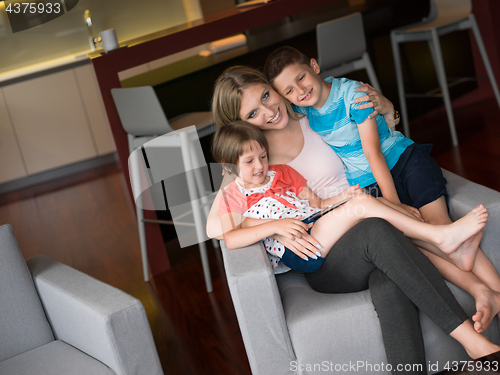 Image of Young Family Using A Tablet To Make Future Plans