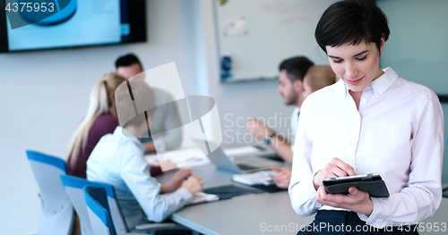 Image of Portrait of  smiling casual businesswoman using tablet  with cow