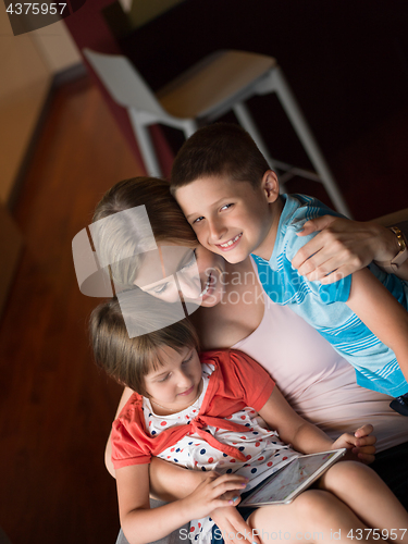 Image of Young Family Using A Tablet To Make Future Plans