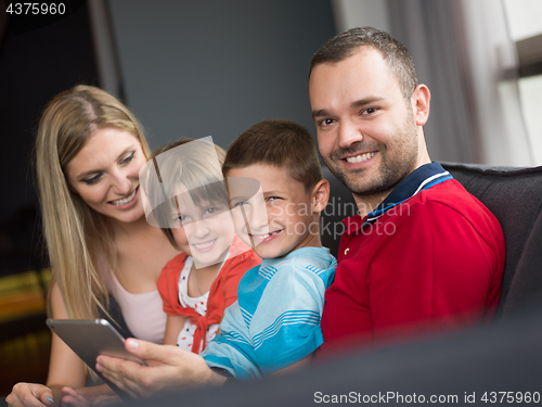 Image of young cuple spending time with kids