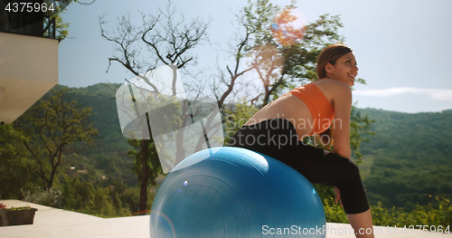 Image of Woman Doing Yoga at villa\'s terase