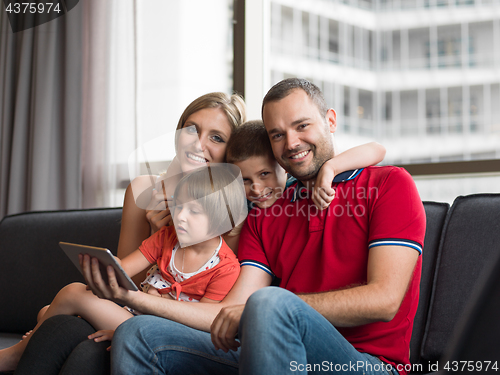 Image of young cuple spending time with kids