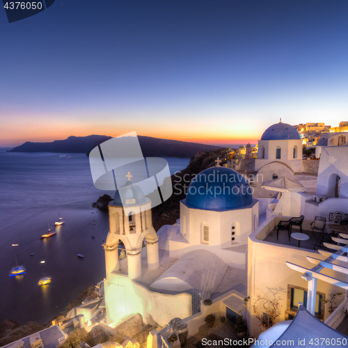 Image of Traditional greek village of Oia at dusk, Santorini island, Greece.