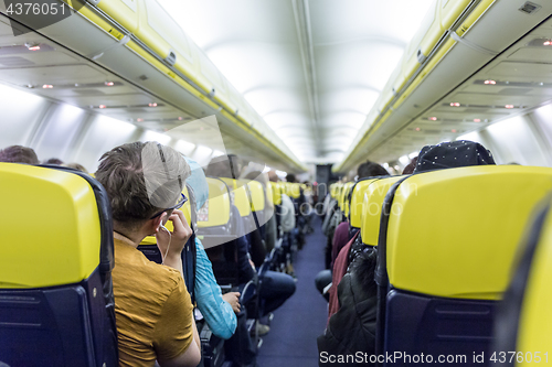 Image of Interior of commercial airplane during flight.