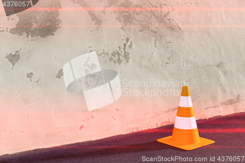 Image of a traffic cone on a wall