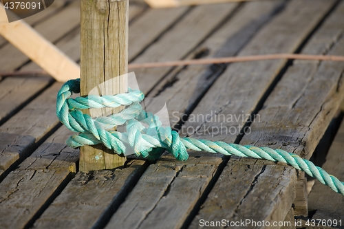 Image of Mooring rope tied on the pier