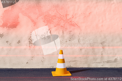 Image of a traffic cone on a wall