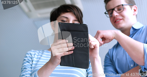 Image of low angle shot of business people using technology