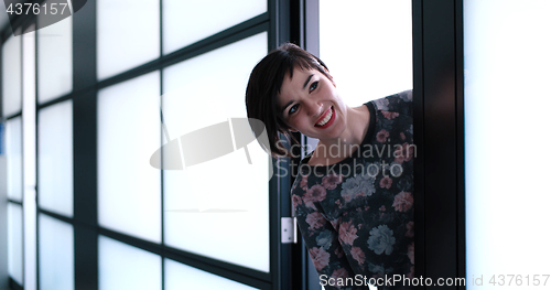 Image of Business woman having fun in office building