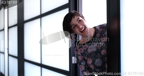 Image of Business woman having fun in office building
