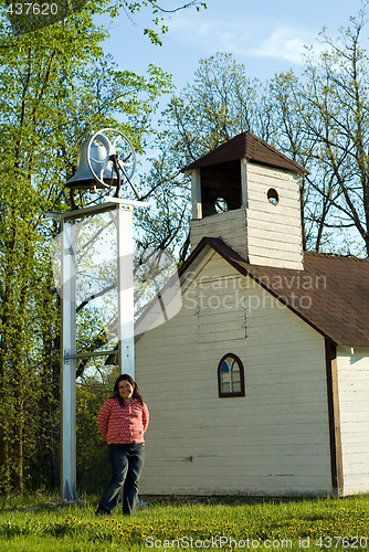 Image of Girl In Front of Schoolhouse