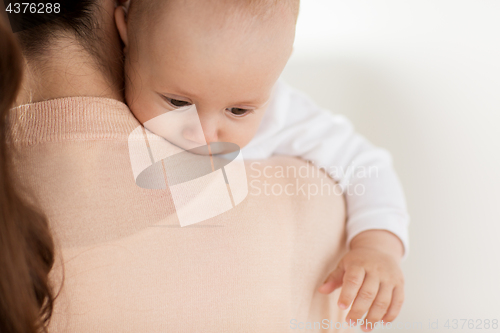 Image of close up of little baby boy with mother