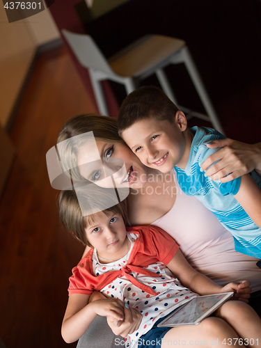 Image of Young Family Using A Tablet To Make Future Plans