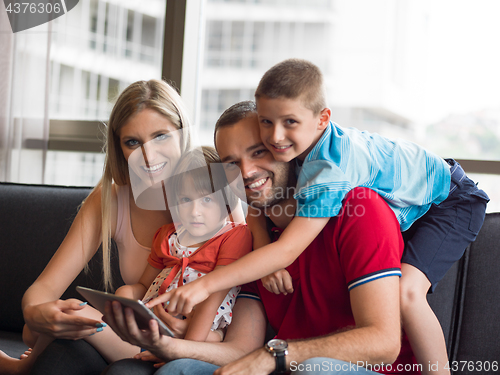 Image of young cuple spending time with kids