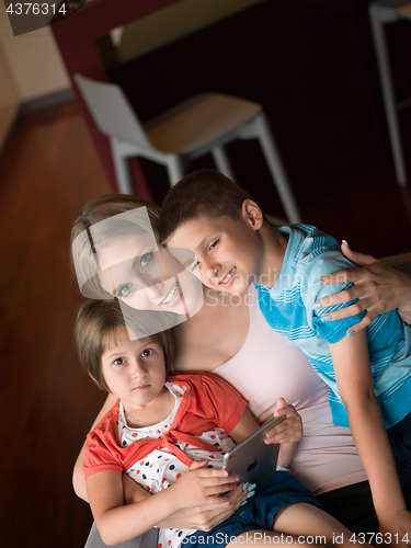 Image of Young Family Using A Tablet To Make Future Plans