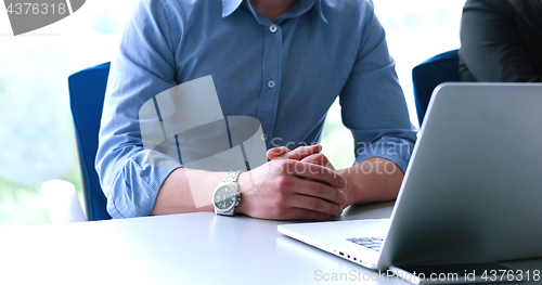 Image of young businessman in startup office