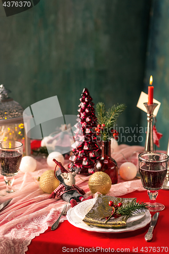 Image of Beautiful Christmas table setting with decorations