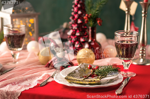 Image of Beautiful Christmas table setting with decorations