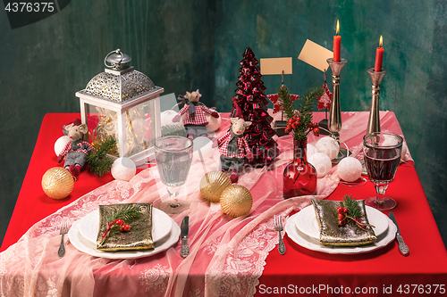 Image of Beautiful Christmas table setting with decorations