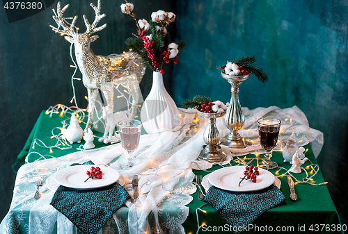 Image of Beautiful Christmas table setting with decorations